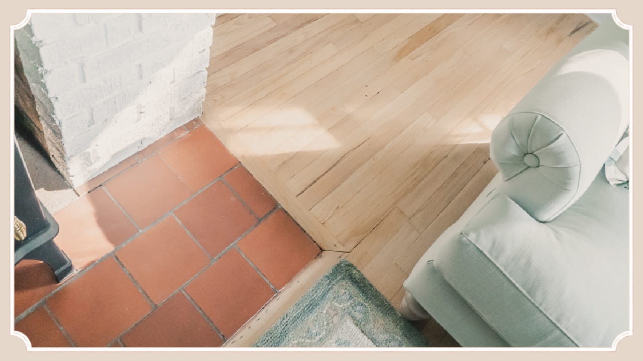 Sunlight shining across the original oak floors and sitting room of The Cottage at Foxhavens, highlighting the craftsmanship of the 1945 home.