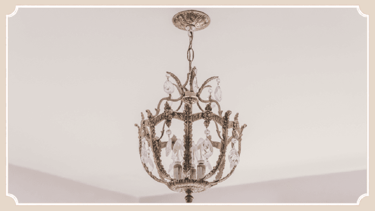 Vintage brass chandelier hanging from the ceiling inside The Cottage at Foxhavens.