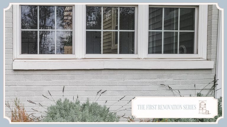 Gray-painted brick exterior and windows of The Cottage at Foxhavens