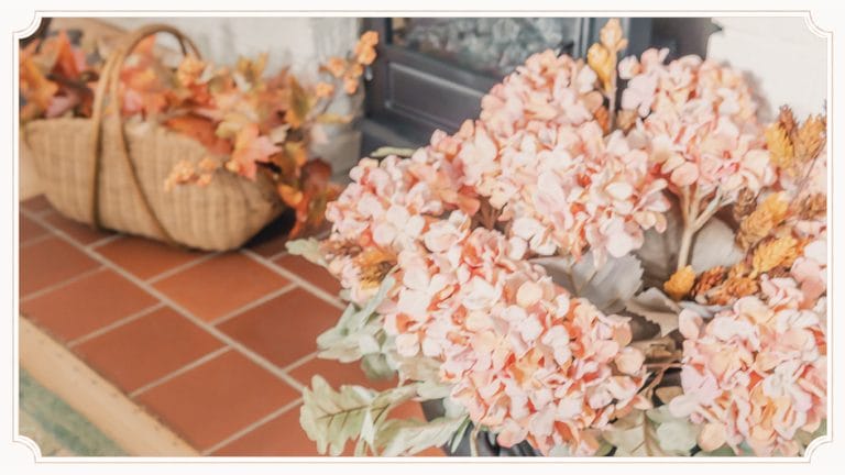 Autumn hydrangeas arranged on the original brick fireplace hearth at The Cottage at Foxhavens